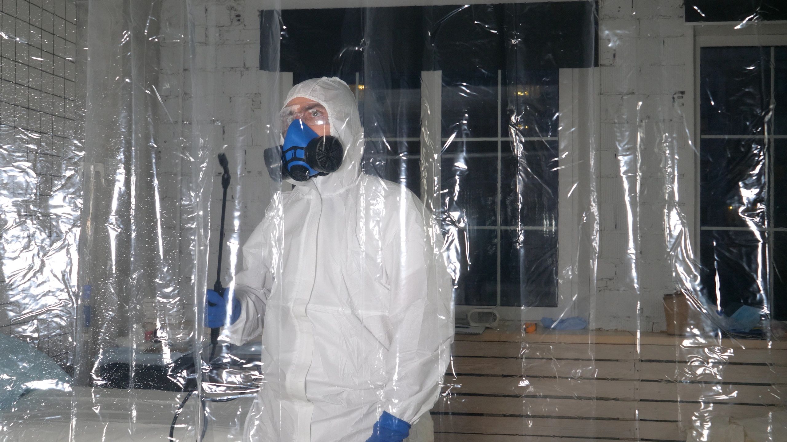 Technician performing odor and contamination treatment
