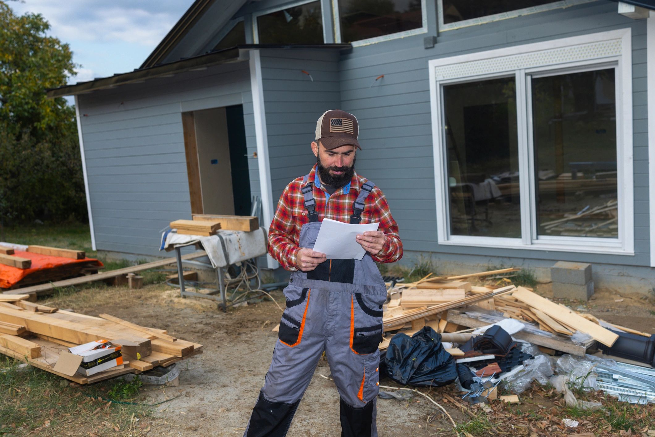 Restoration professional reviewing plans and documentation at a job site