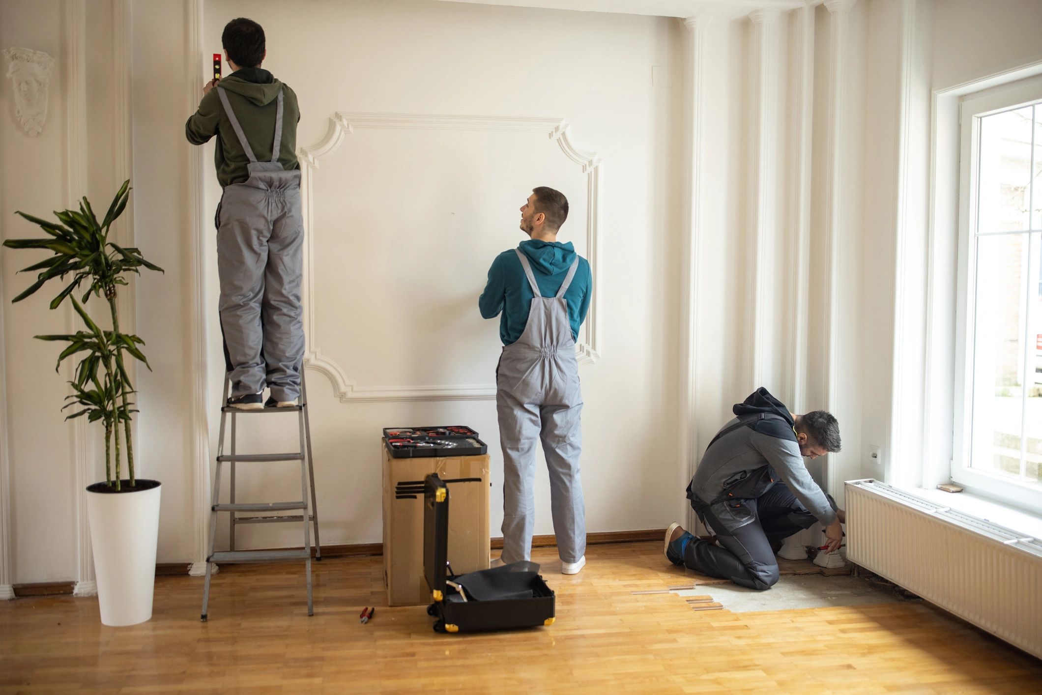Restoration professionals working inside a client's home