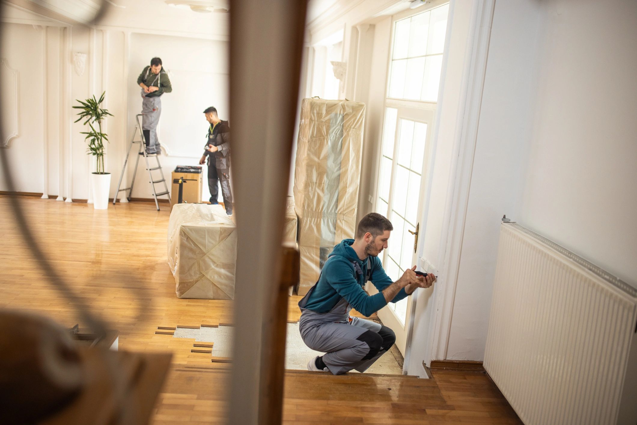 Restoration crew coordinating work inside a property